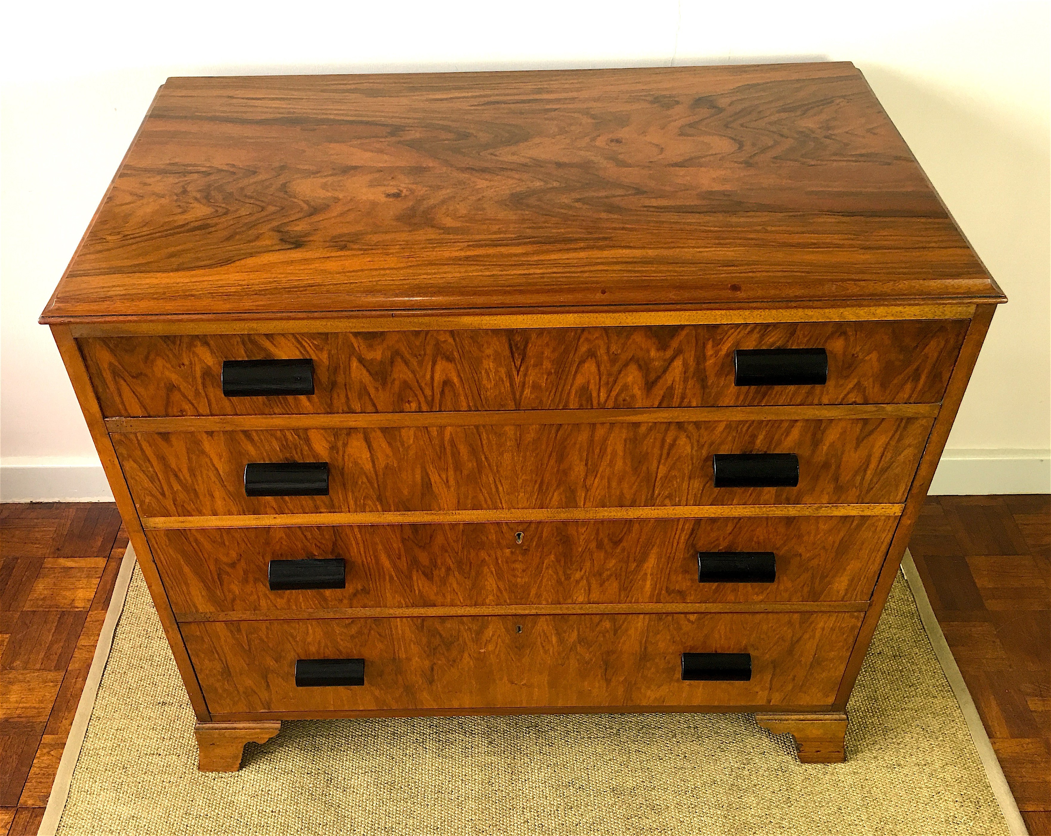 An Art Deco style figured walnut chest of four drawers, width 92cm, depth 50cm, height 83cm